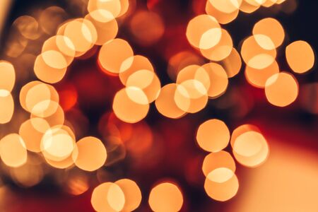 Abstract Christmas bokeh background. Red black and yellow colorsの写真素材