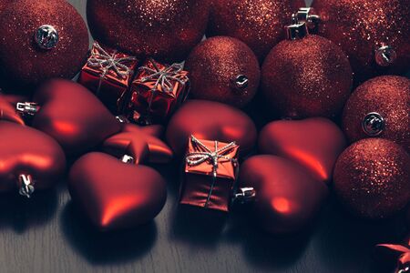 Christmas toys and balls flatlay over dark background.の写真素材