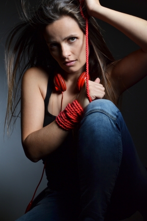 A beautiful young woman with the red headphones の写真素材