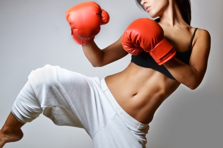 beautiful woman with the red boxing gloves, studio shotの写真素材