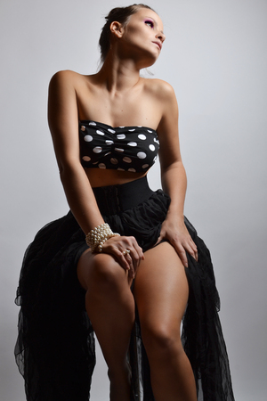 beautiful young woman posing in the studioの写真素材