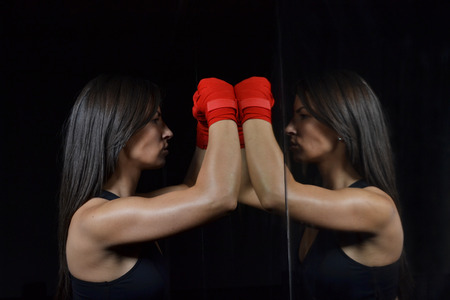  beautiful fitness woman with the red boxing bandageの写真素材