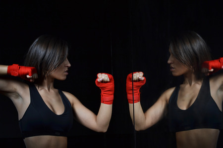  beautiful fitness woman with the red boxing bandageの写真素材