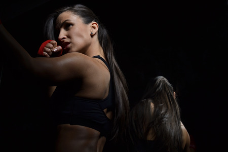  beautiful fitness woman with the red boxing bandageの写真素材