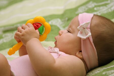 Toddler Lying on a Bedの写真素材