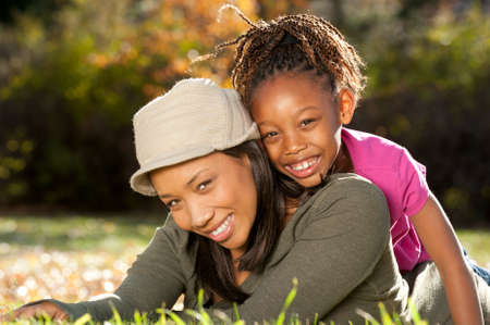 Mother and child having fun in a parkの写真素材