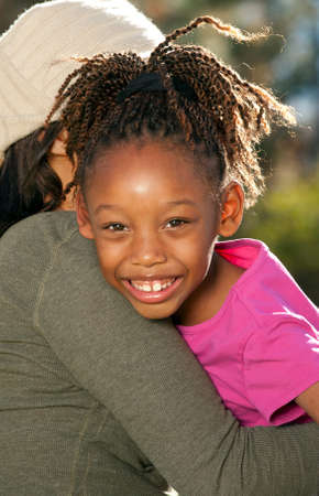 Mother embracing child の写真素材