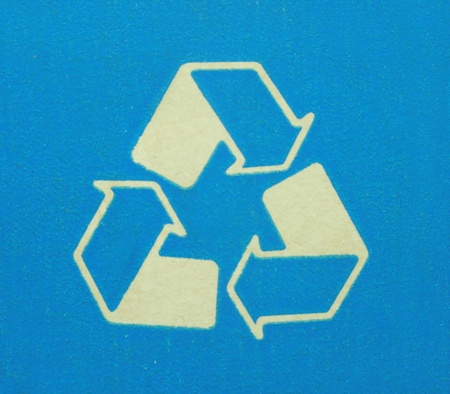 Recyclable background A recycling symbol on blueの写真素材