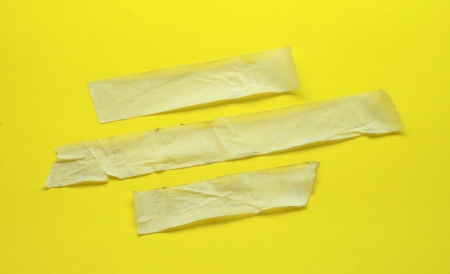 Strips of masking tape  Isolated on yellowの写真素材