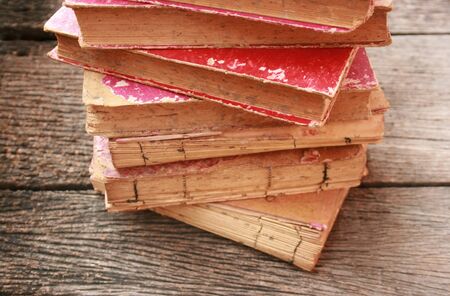 stack old books on old woodの写真素材