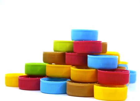 colorful plastic bottle caps isolated
