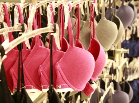 Row of bras hanging in lingerie storeの写真素材