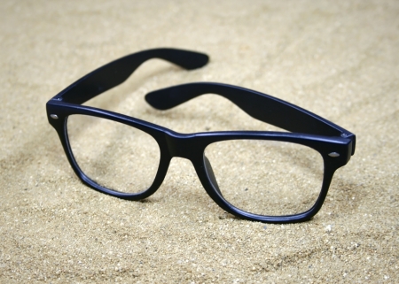 Sunglasses on sandの写真素材