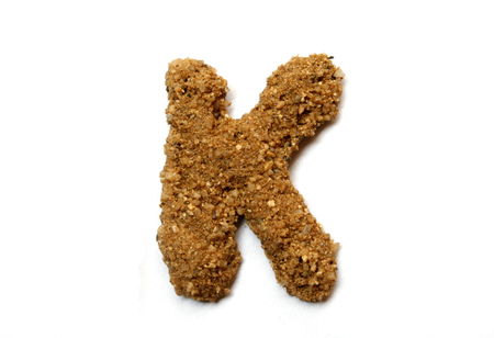 Sand letter isolated on whiteの写真素材