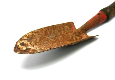 Small rusty shovel isolated on whiteの写真素材