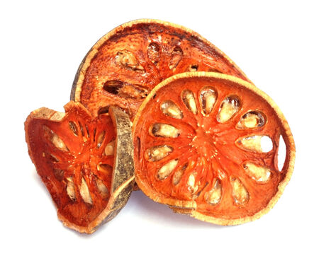 dried quince slices on a white background