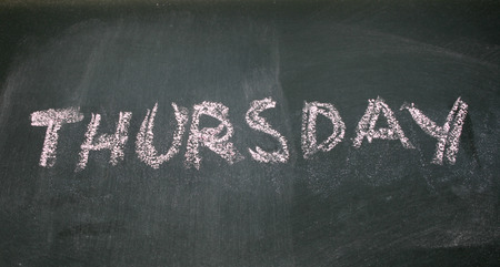 thursday written with chalk on blackboardの写真素材