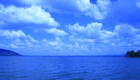 Summer landscape with sea and horizon over waterの写真素材