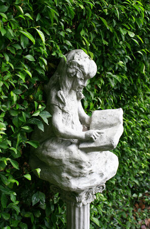 Children statue and green backgroundの写真素材