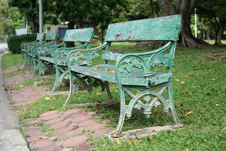 metal and wood garden chair on green grass