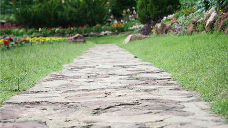 closeup stone pathway into garden