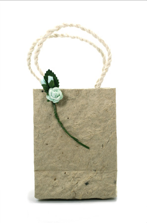 Brown mulberry paper bag isolated with flowerの写真素材