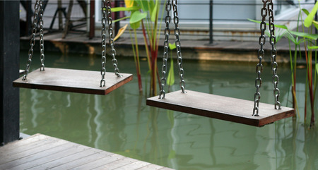 Wooden swing chair in parkの写真素材