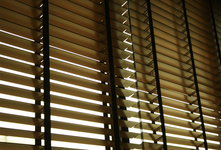 Blinds in a home catching the sunlightの写真素材