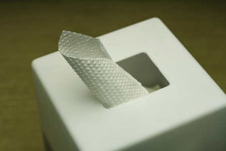 closeup of tissue in paper box dim light with a very shallow depth of fieldの写真素材