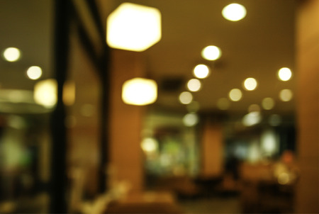 Blurred background : Customer at restaurant blur background with bokeh in dim lightの写真素材