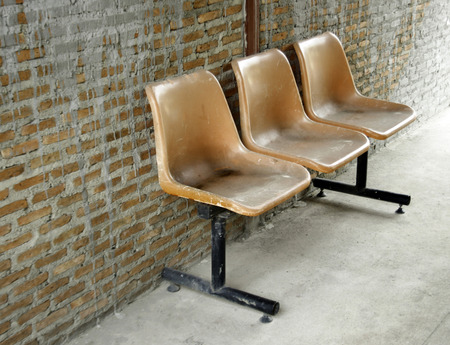 the old row chairs on the floorの写真素材