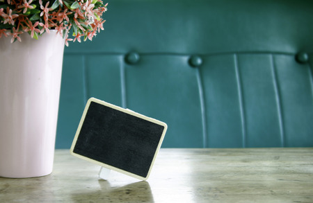 blackboard with flower in vaseの写真素材