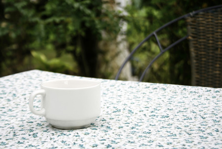 Coffee cup on table clothの写真素材