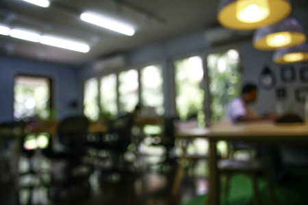 Blurred man with laptop at cafe background, business , technology conceptの写真素材