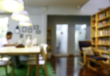 Blurred man with laptop at cafe background, business , technology conceptの写真素材