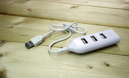 USB 2.0 4 ports on wood table backgroundの写真素材