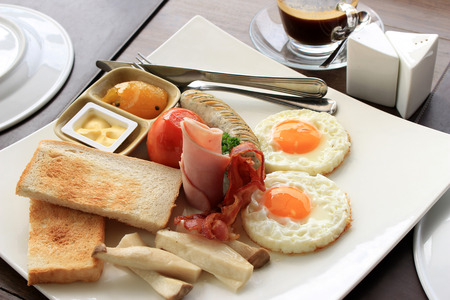 English breakfast - toast, egg, bacon and vegetables
