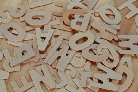 Wooden ABC letter alphabet on the wooden backgroundの写真素材