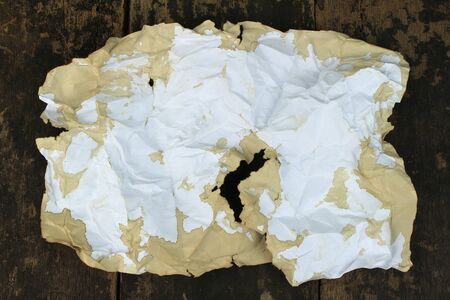 old paper on brown aged wood