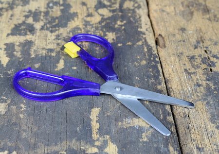 scissors on wood backgroundの写真素材