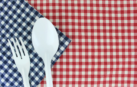 fork and spoon on tablecloth for food serving backgroundの写真素材