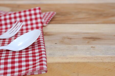 fork and spoon on  tablecloth for food serving backgroundの写真素材