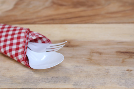fork and spoon on tablecloth for food serving backgroundの写真素材