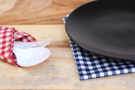 the plate on checkered tablecloth