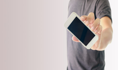 a man using hand holding the smartphone