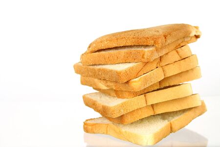 The cut loaf of bread with reflection isolated on white