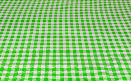 Wooden table covered with tablecloth. View from top. Empty tablecloth for product montage. Free space for products and for your textの写真素材