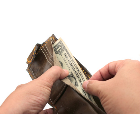 Isolated brown leather wallet with us money banknotes on white background