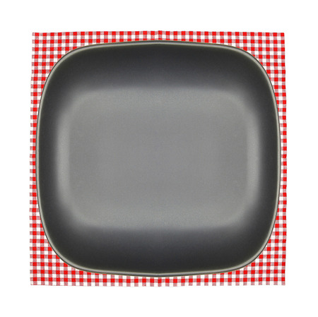 Top view plate on checkered tablecloth pattern backgroundの写真素材
