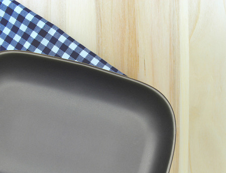 Top view plate on checkered tablecloth pattern background .Free space for products and for your text